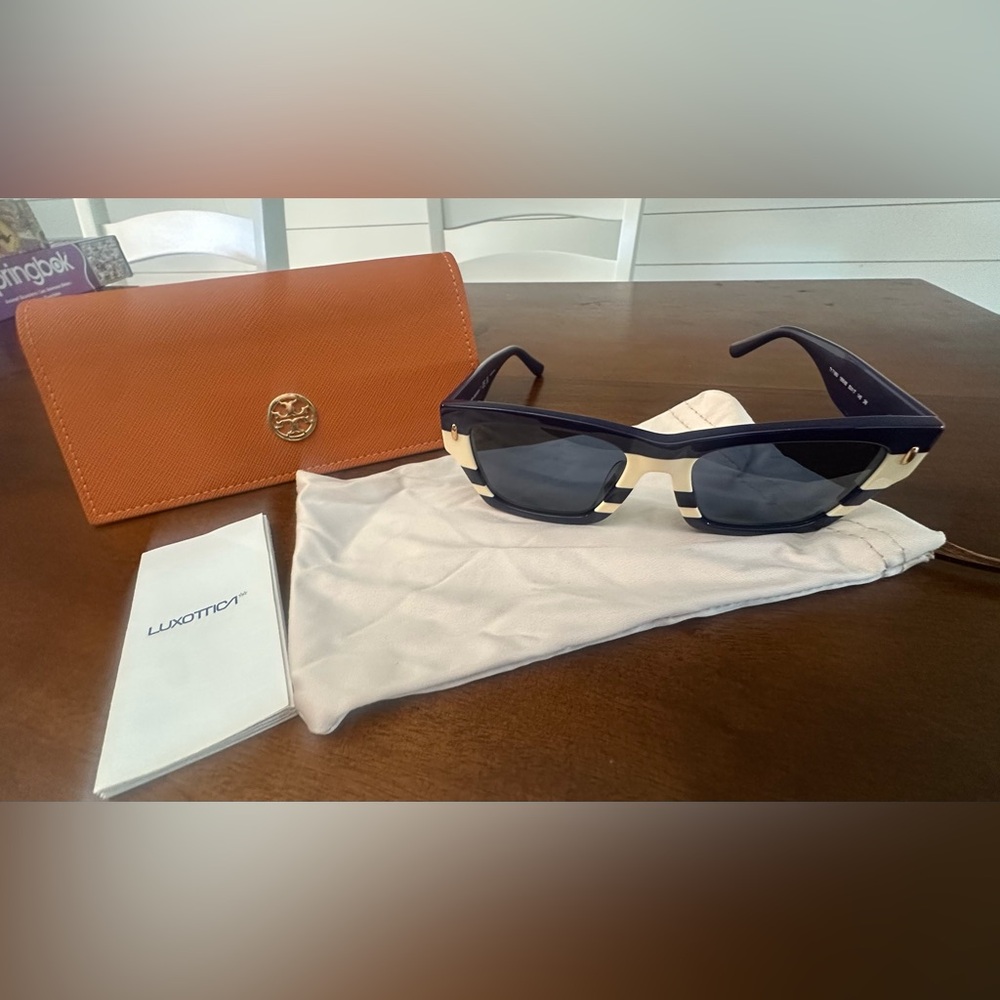 NWOT .. Tory Burch Blue Sunglasses with Cream Accents
Never worn.